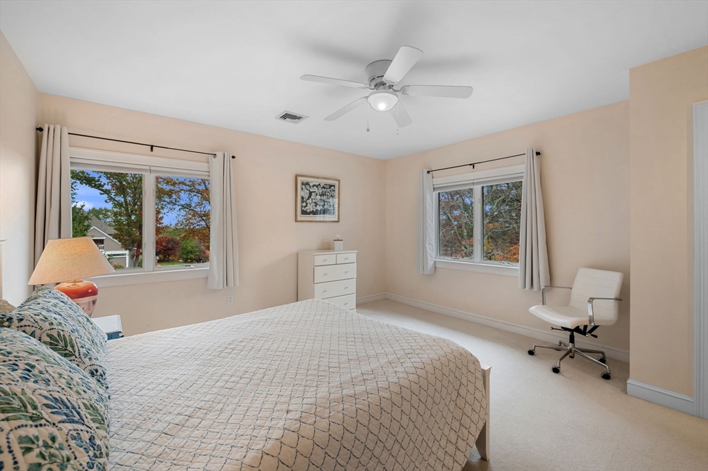 1 Court Lane Ipswich, MA 01938 - Photo 28 of 40 a bedroom with a bed and wooden floor