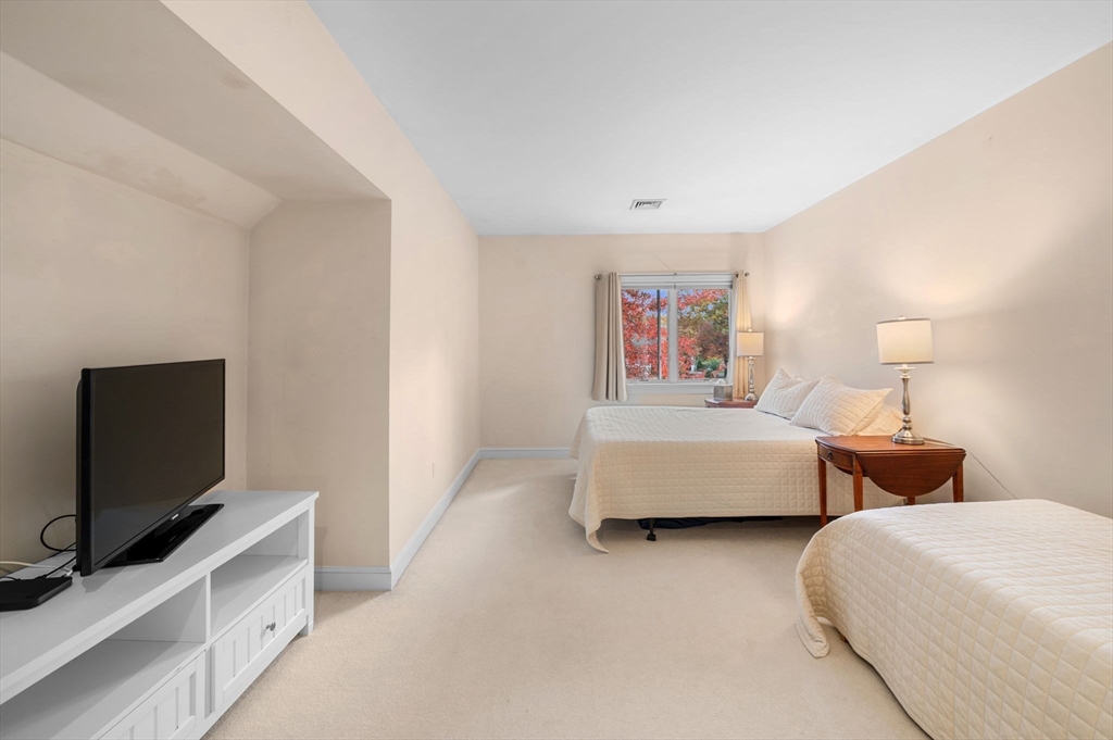1 Court Lane Ipswich, MA 01938 - Photo 32 of 40 a bedroom with two bed and a flat screen tv
