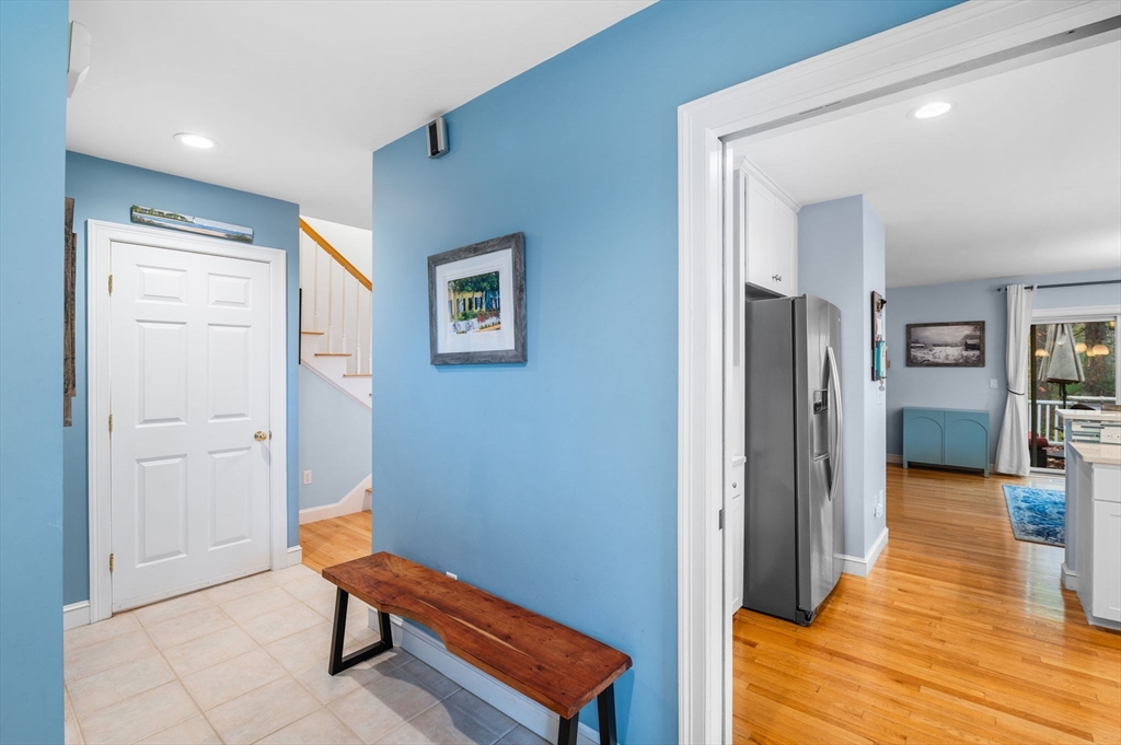 1 Court Lane Ipswich, MA 01938 - Photo 6 of 40 a view of a hallway with wooden floor and furniture