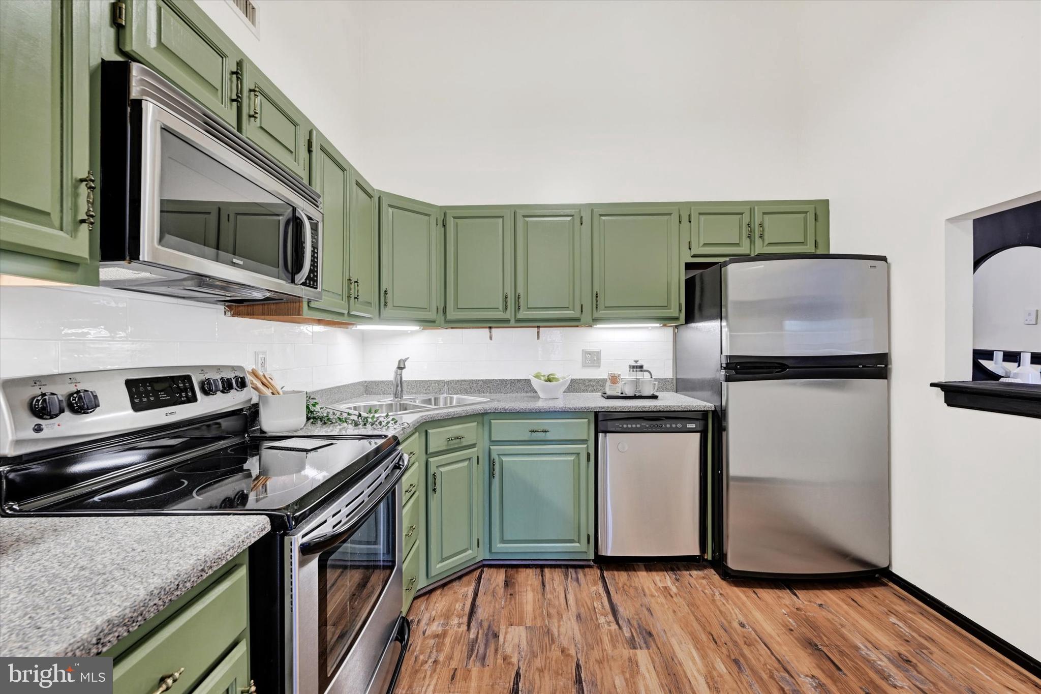 22 Rain Flower Path, Unit 301 Sparks Glencoe, MD 21152 - Photo 11 of 21 a kitchen with a sink appliances and cabinets