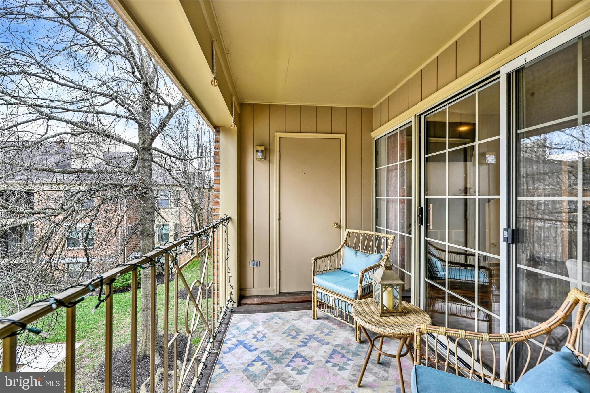 22 Rain Flower Path, Unit 301 Sparks Glencoe, MD 21152 - Photo 20 of 21 a balcony with wooden floor and furniture