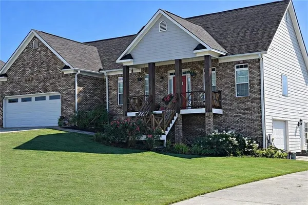 a front view of a house with garden