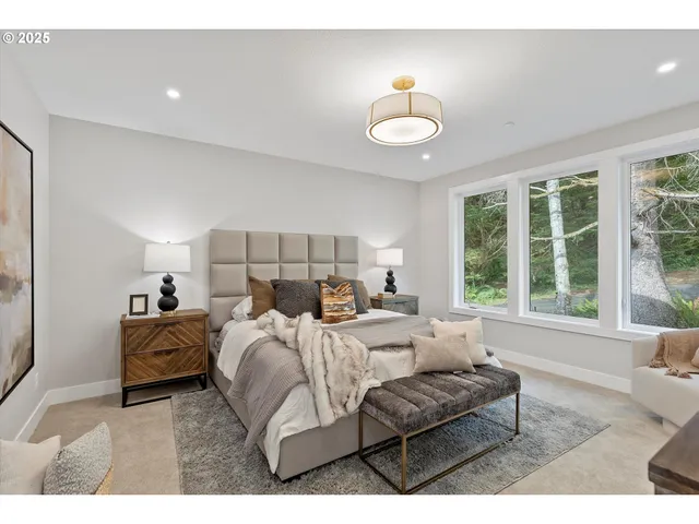 a bedroom with bed and a chandelier