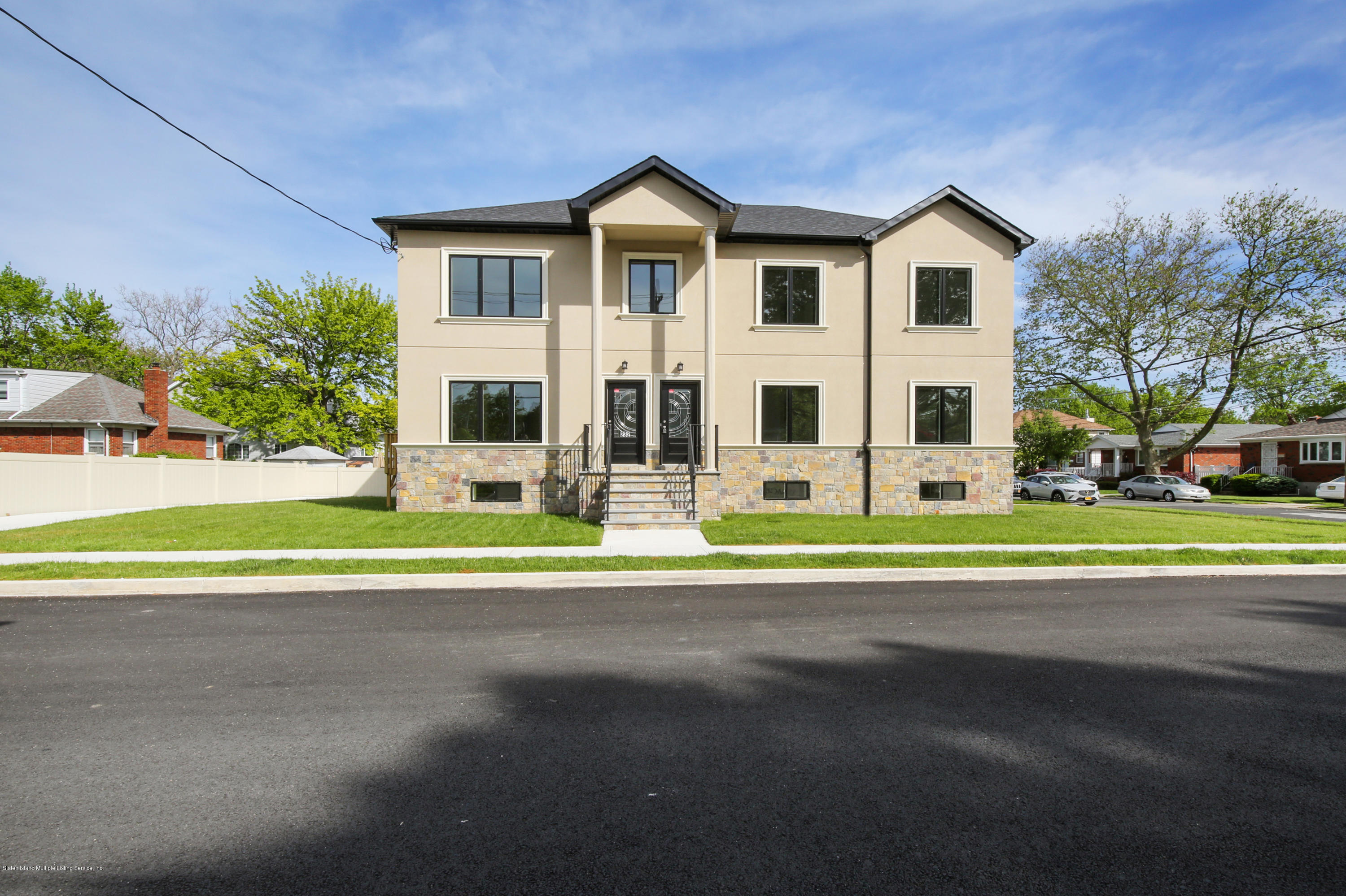 a view of a house with a yard and plants