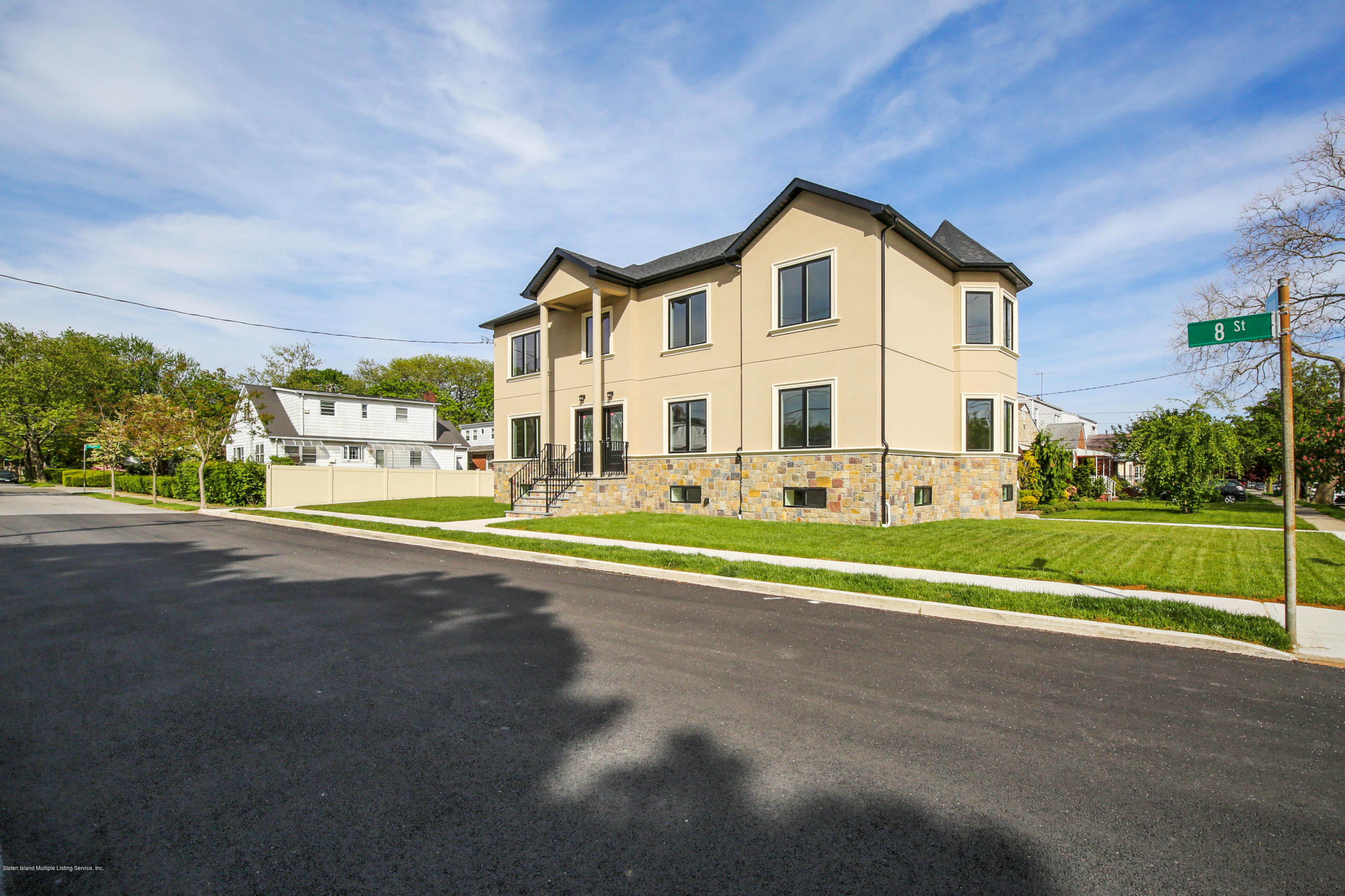 232 8 Street Staten Island, NY 10306 - Photo 2 of 25 a view of an house with a big yard and large trees