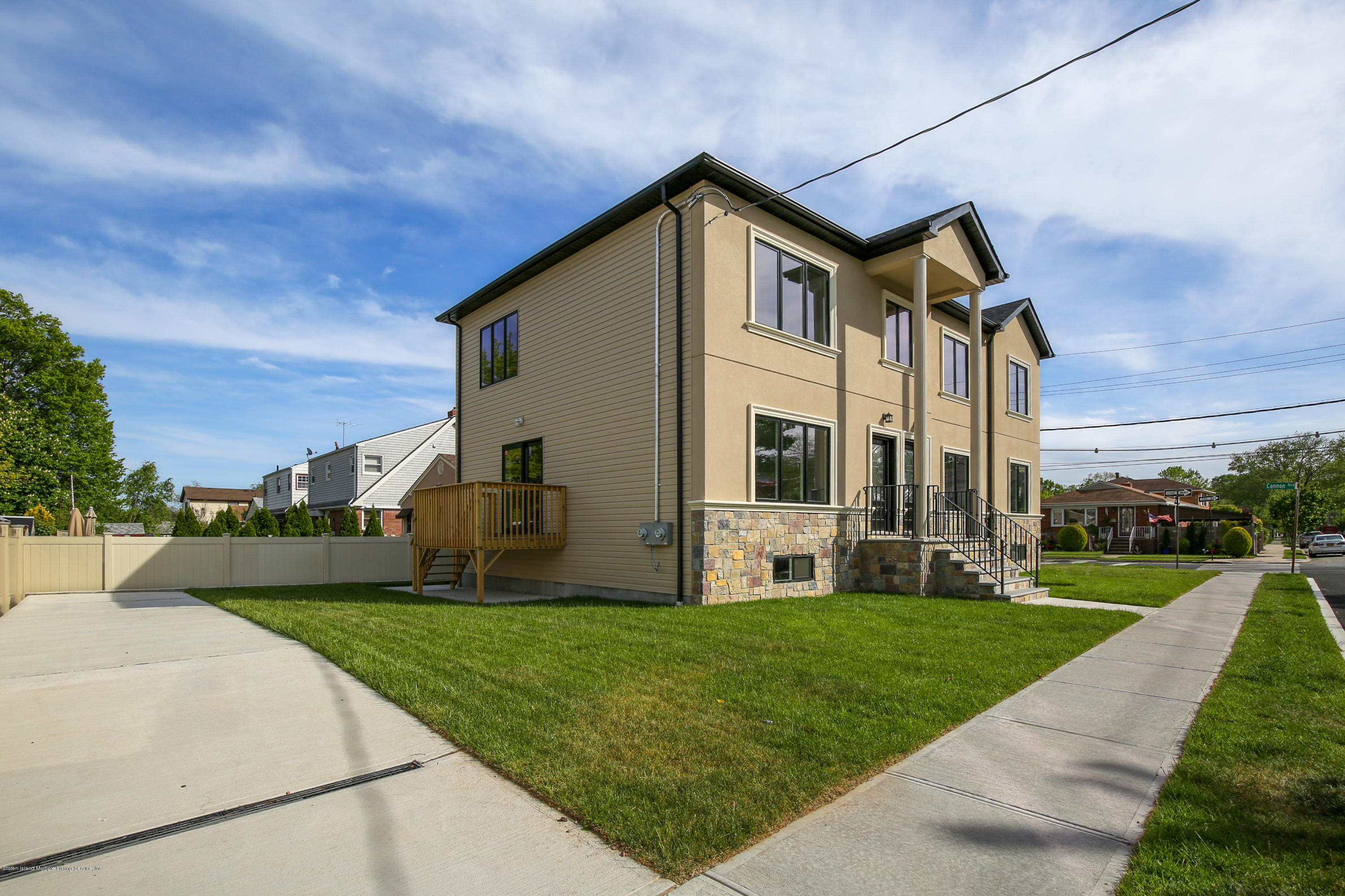 232 8 Street Staten Island, NY 10306 - Photo 25 of 25 a front view of a house with a yard and garage