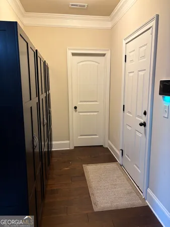 an entryway with a hardwood floor