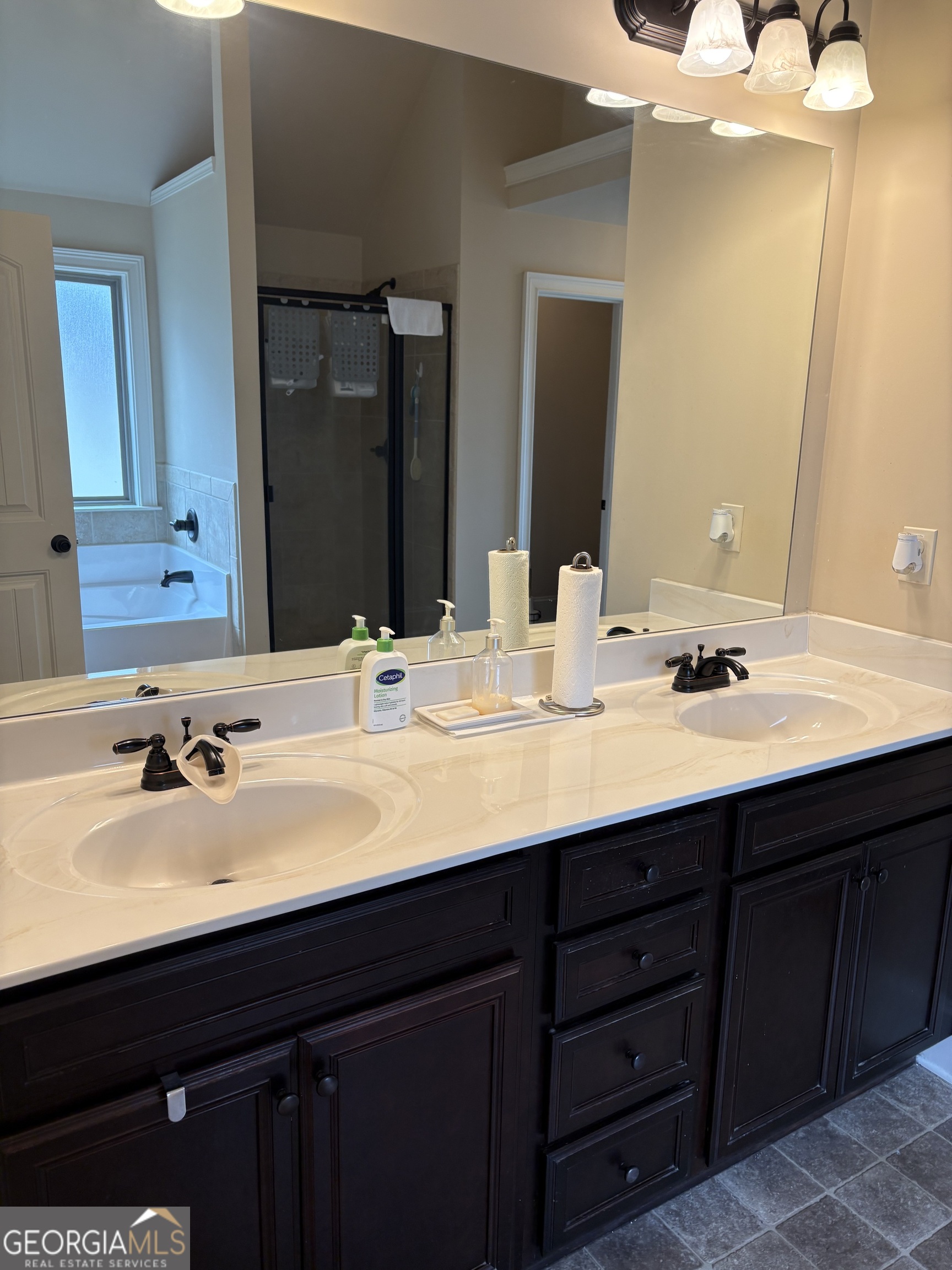 208 Deodar Lane Hampton, GA 30228 - Photo 19 of 28 a bathroom with double vanity sinks and a mirror