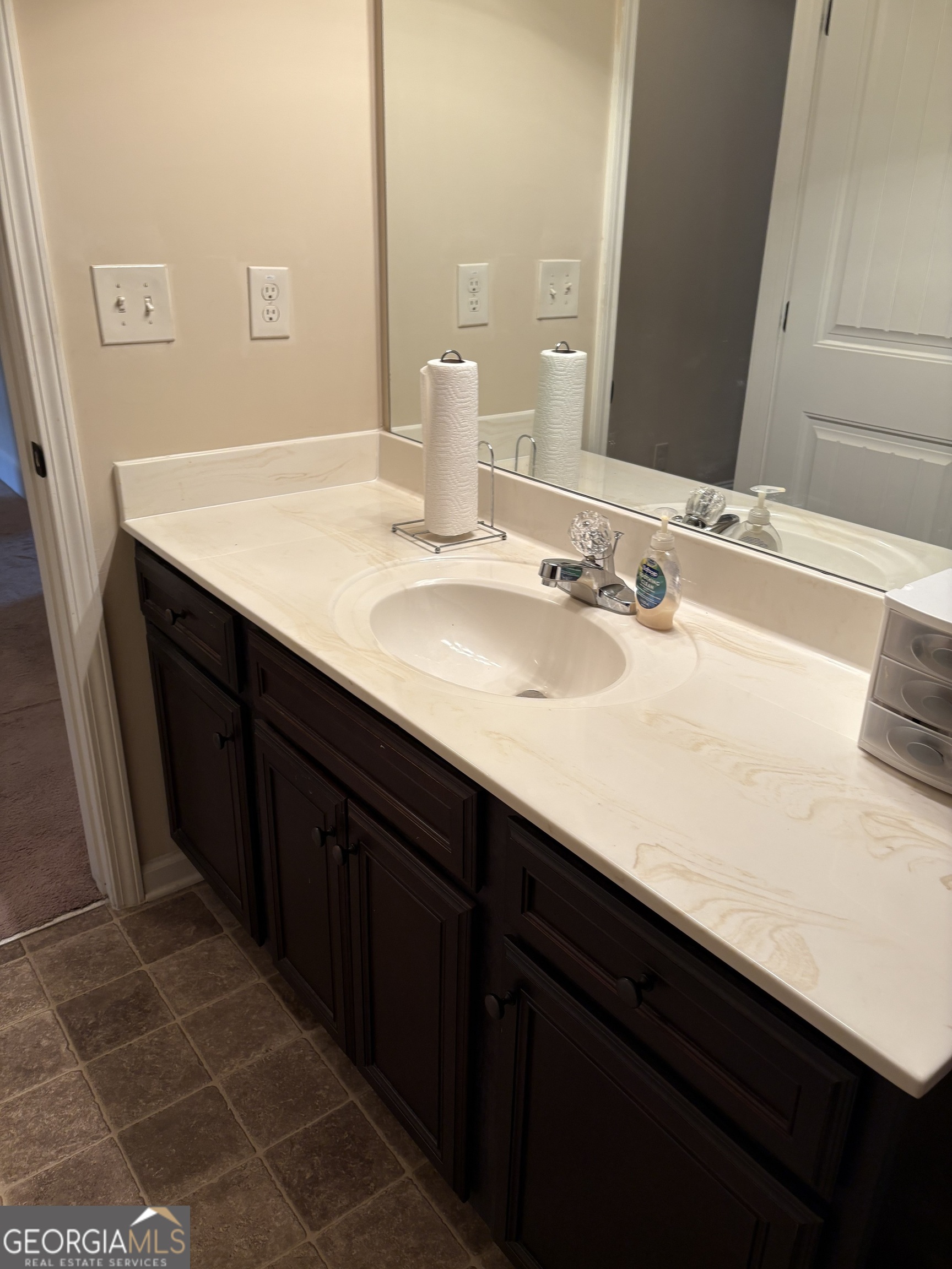 208 Deodar Lane Hampton, GA 30228 - Photo 26 of 28 a bathroom with a double vanity sink and a mirror