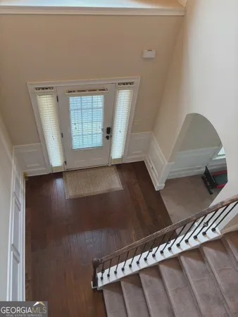 a view of an empty room with windows