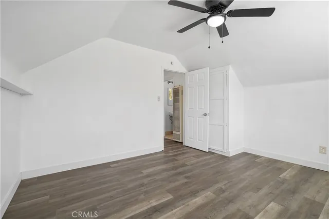 an empty room with wooden floor