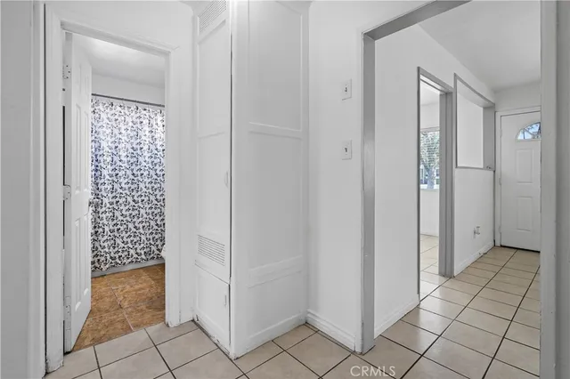 a kitchen with a stove a refrigerator and a sink
