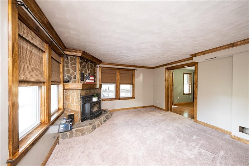 1810 Glen Road Aliquippa, PA 15001 - Photo 3 of 24 The stone fireplace welcomes you into the spacious family room.