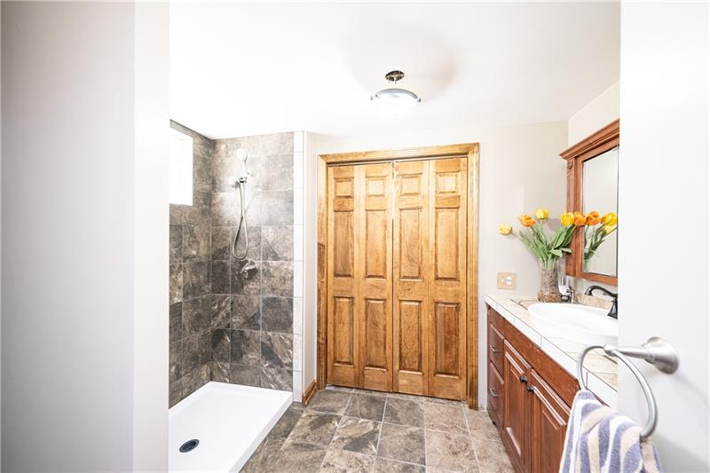 1810 Glen Road Aliquippa, PA 15001 - Photo 8 of 24 Located on the main level, you'll find a custom tiled, walk-in shower, as well as a beautifully tiled vanity.