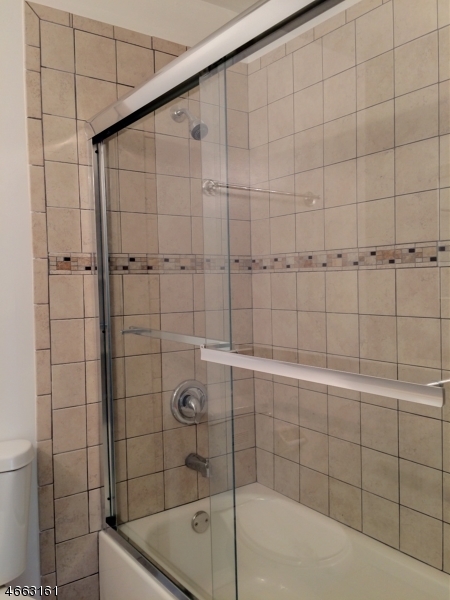 64 Sycamore Court Bernards, NJ 07920 - Photo 14 of 27 a bathroom with a shower