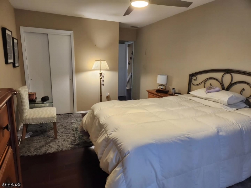 64 Sycamore Court Bernards, NJ 07920 - Photo 17 of 27 a bedroom with a bed and a mirror on dresser