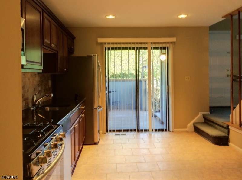 64 Sycamore Court Bernards, NJ 07920 - Photo 6 of 27 a kitchen with stainless steel appliances granite countertop a refrigerator and a stove