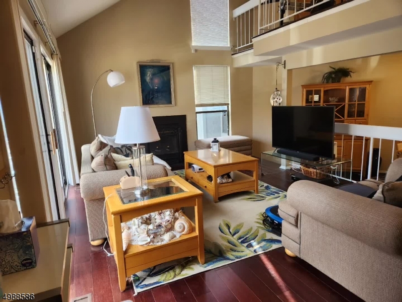 64 Sycamore Court Bernards, NJ 07920 - Photo 10 of 27 a living room with furniture and a flat screen tv