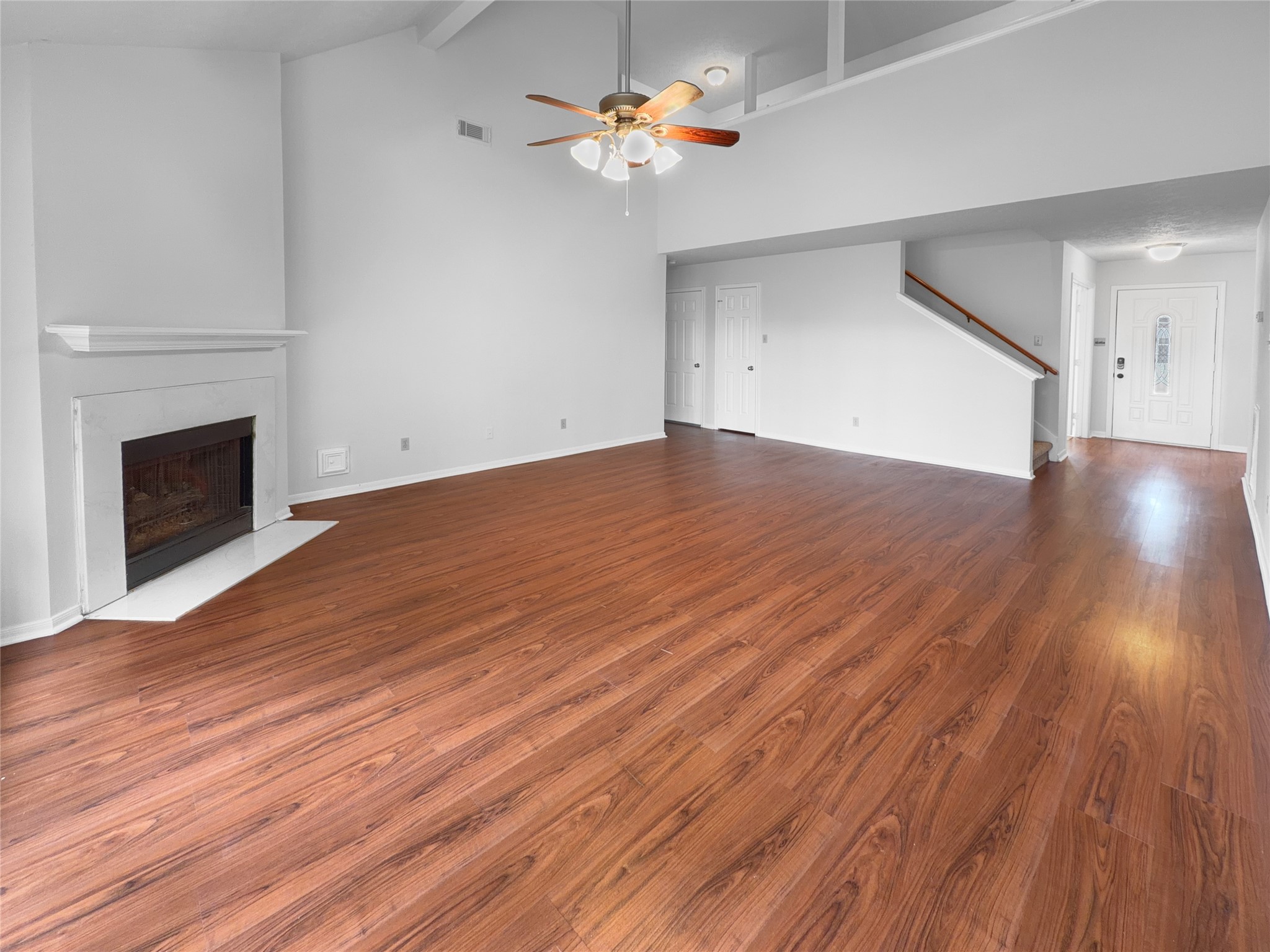 2130 Medway Drive Spring, TX 77386 - Photo 12 of 21 a view of an empty room with wooden floor and a fireplace