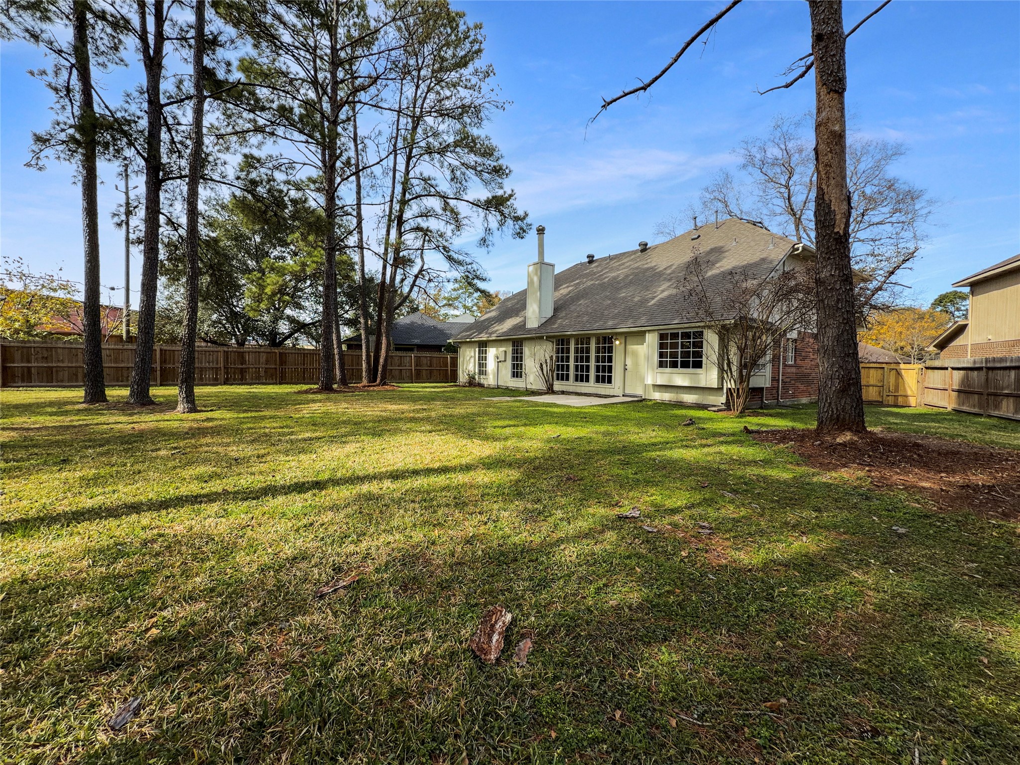 2130 Medway Drive Spring, TX 77386 - Photo 20 of 21 a view of a building with a big yard