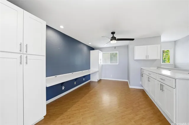 a kitchen with stainless steel appliances a sink and a refrigerator