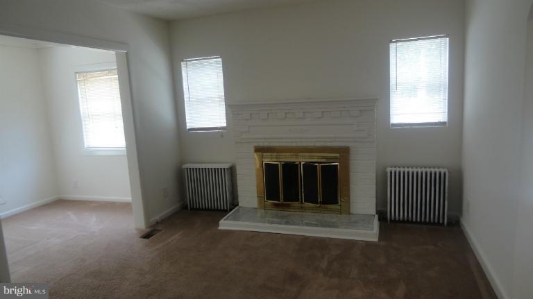 16706 Livingston Road Accokeek, MD 20607 - Photo 22 of 30 an empty room with windows and fireplace
