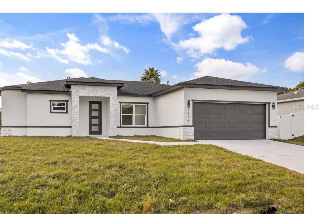 a house with swimming pool in front of it