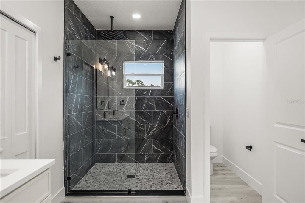 2798 Gainesville Road Southeast Palm Bay, FL 32909 - Photo 13 of 35 a bathroom with a shower