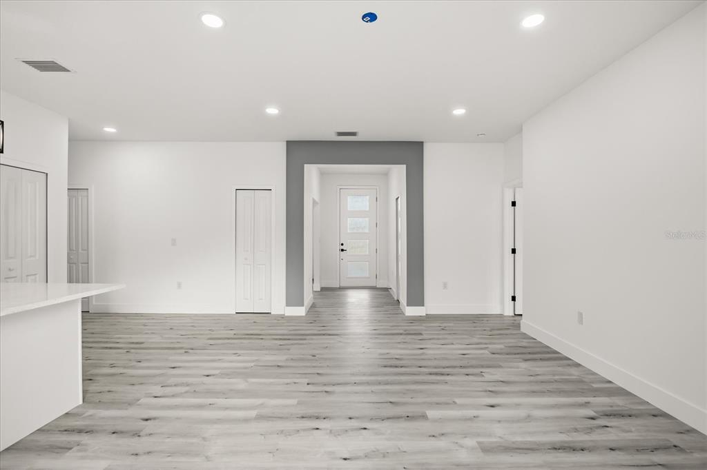 2798 Gainesville Road Southeast Palm Bay, FL 32909 - Photo 9 of 35 a view of empty room with wooden floor