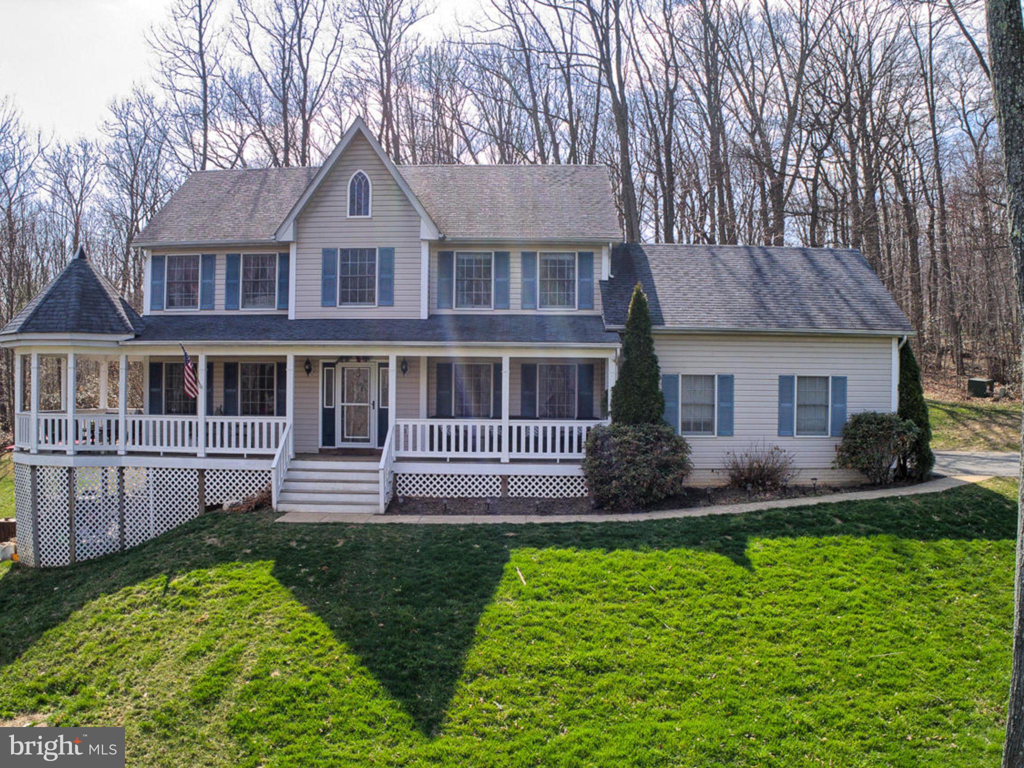 3364 Basford Road Frederick, MD 21703 - Photo 1 of 30 a front view of a house with a yard and outdoor seating