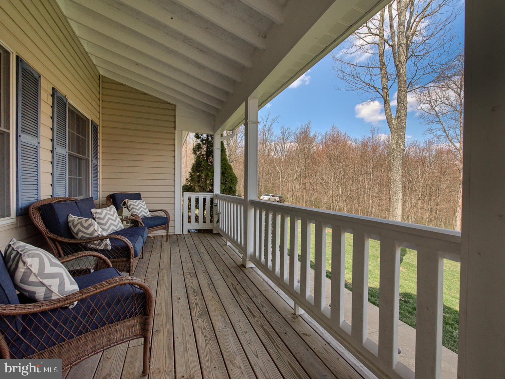 3364 Basford Road Frederick, MD 21703 - Photo 2 of 30 a balcony with furniture and wooden floor
