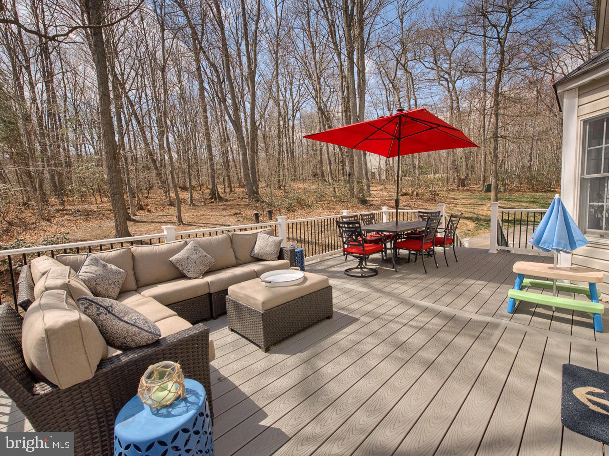 3364 Basford Road Frederick, MD 21703 - Photo 12 of 30 an outdoor sitting area with furniture and wooden deck