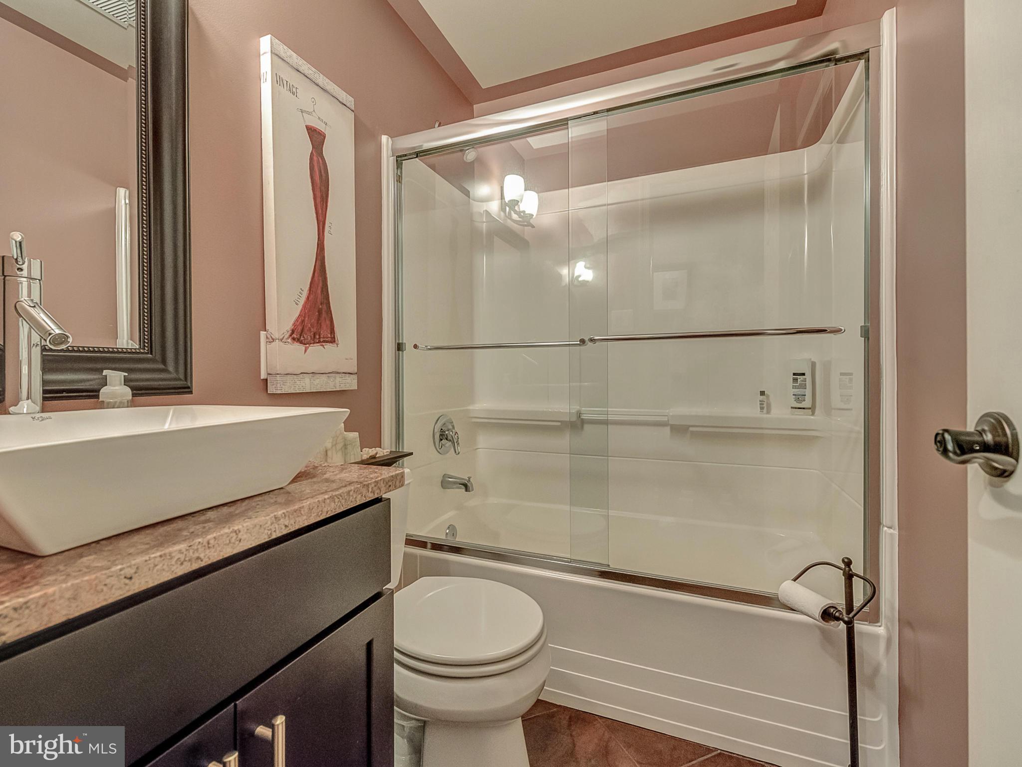 3364 Basford Road Frederick, MD 21703 - Photo 25 of 30 a bathroom with a granite countertop sink toilet and shower
