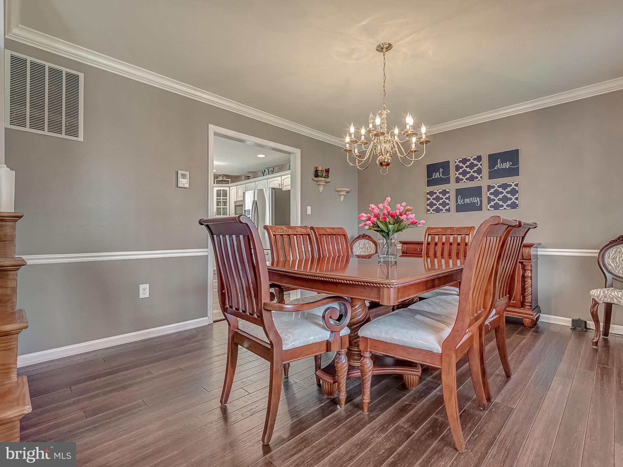 3364 Basford Road Frederick, MD 21703 - Photo 6 of 30 a view of a dining room with furniture wooden floor and chandelier