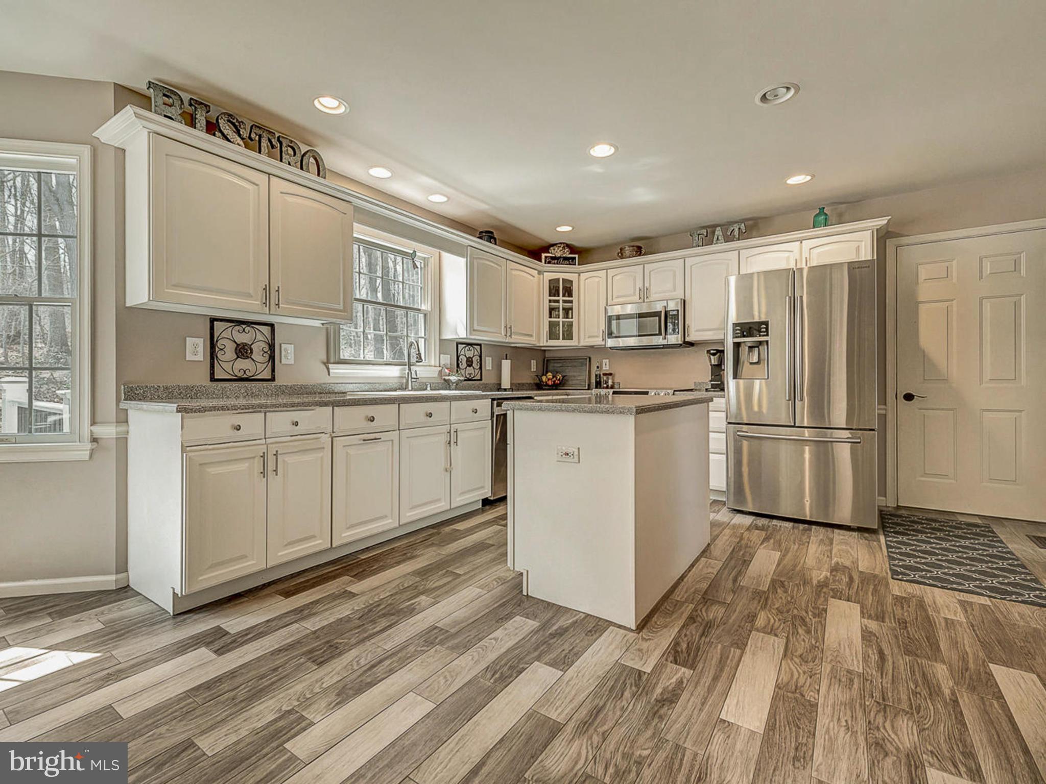 3364 Basford Road Frederick, MD 21703 - Photo 7 of 30 a kitchen with stainless steel appliances a refrigerator sink and cabinets