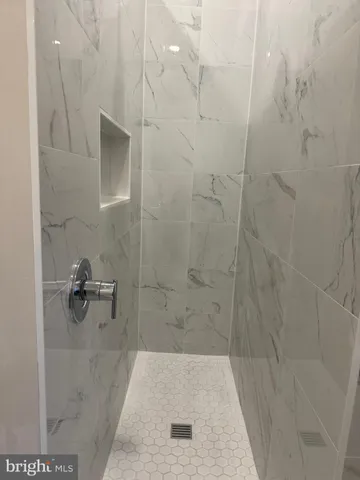 a white toilet sitting next to a bathroom sink