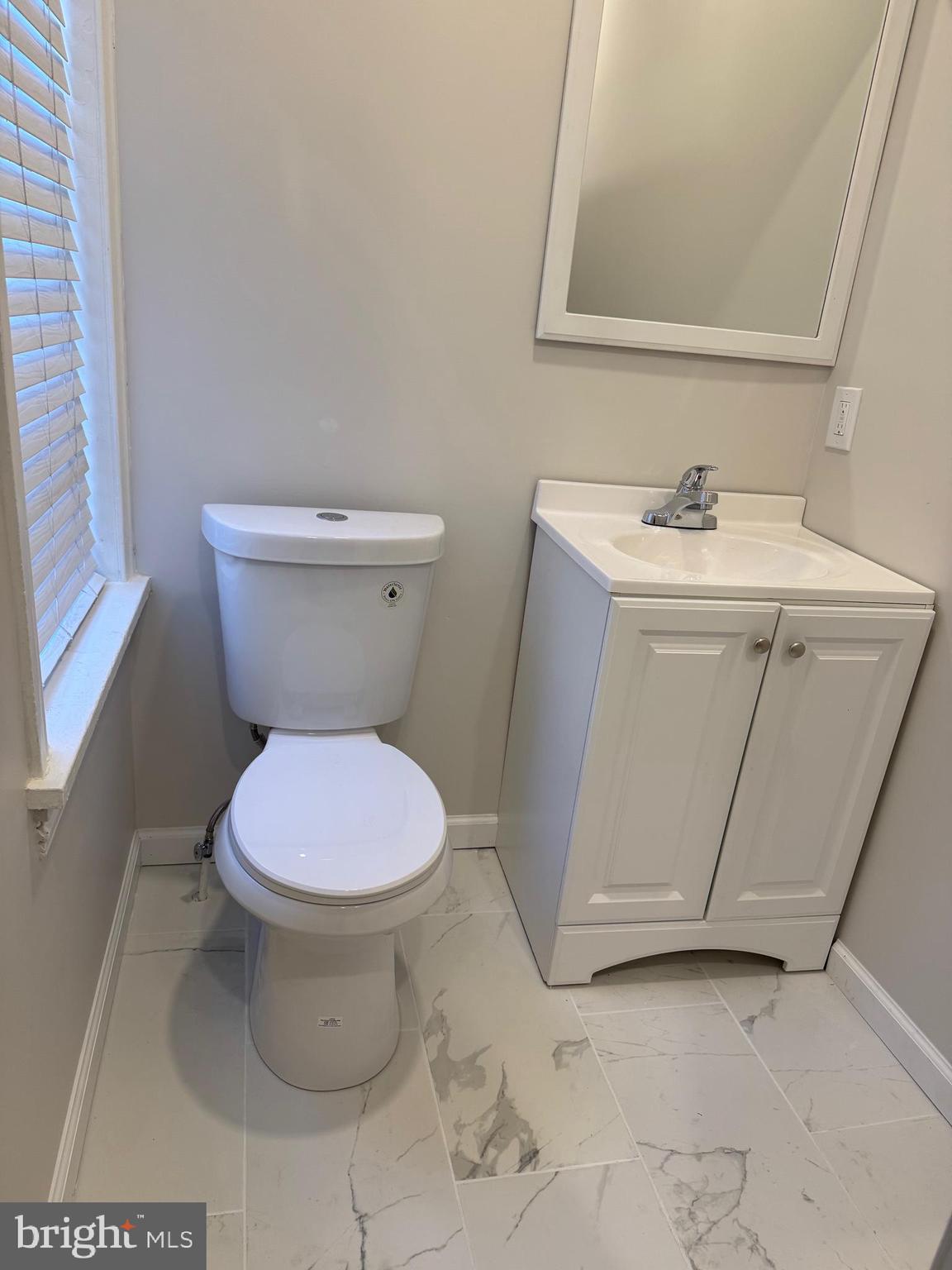1812 Delaware Avenue, Unit 2 Wilmington, DE 19806 - Photo 12 of 13 a white toilet sitting next to a bathroom sink