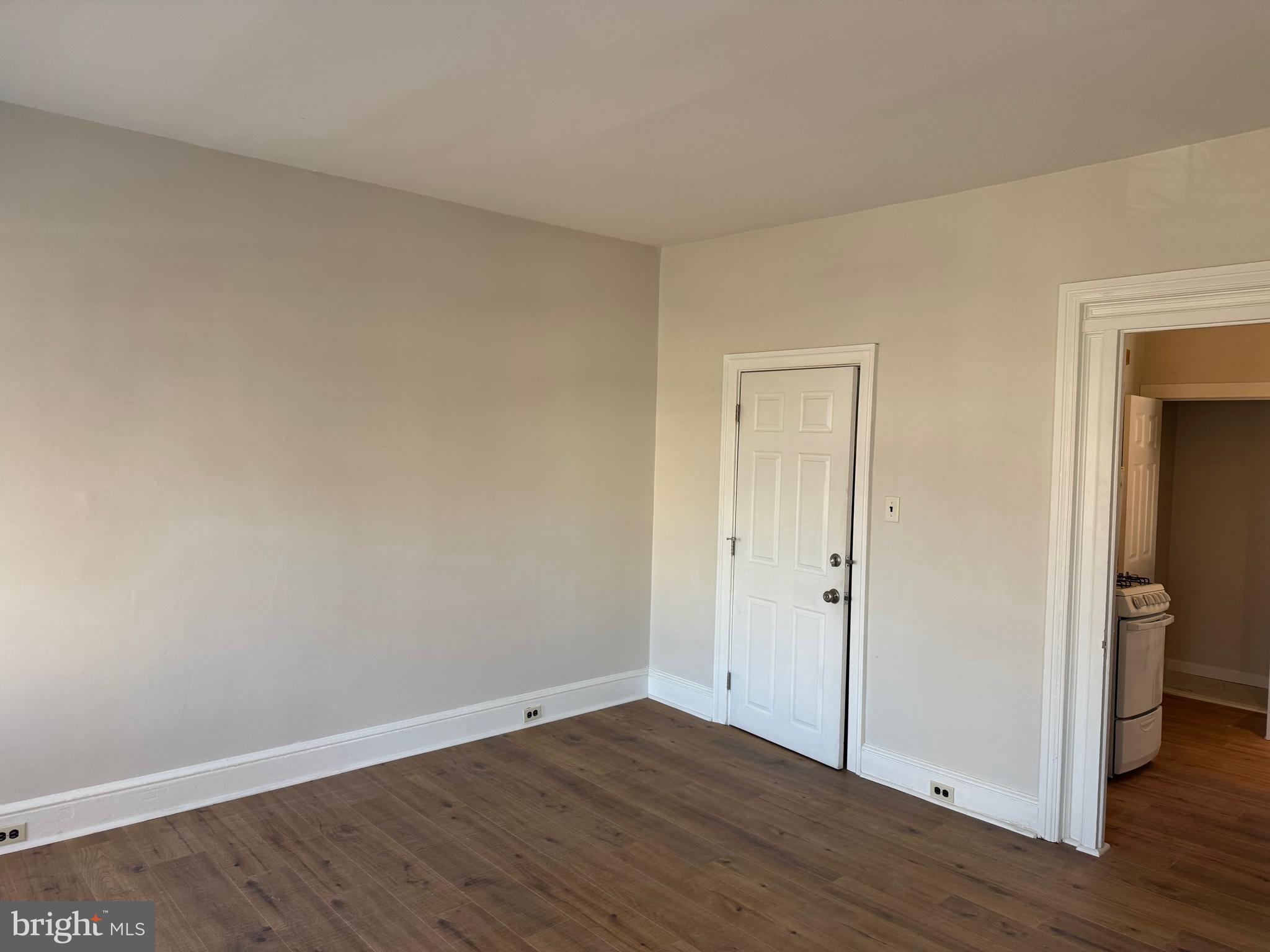 1812 Delaware Avenue, Unit 2 Wilmington, DE 19806 - Photo 7 of 13 a view of an empty room with wooden floor and closet
