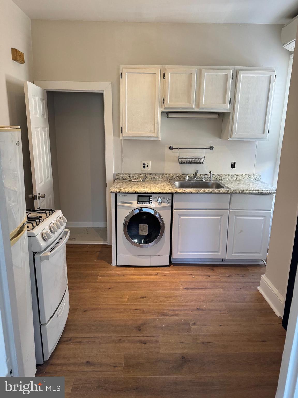 1812 Delaware Avenue, Unit 2 Wilmington, DE 19806 - Photo 8 of 13 a kitchen with stainless steel appliances granite countertop a stove a sink and a refrigerator