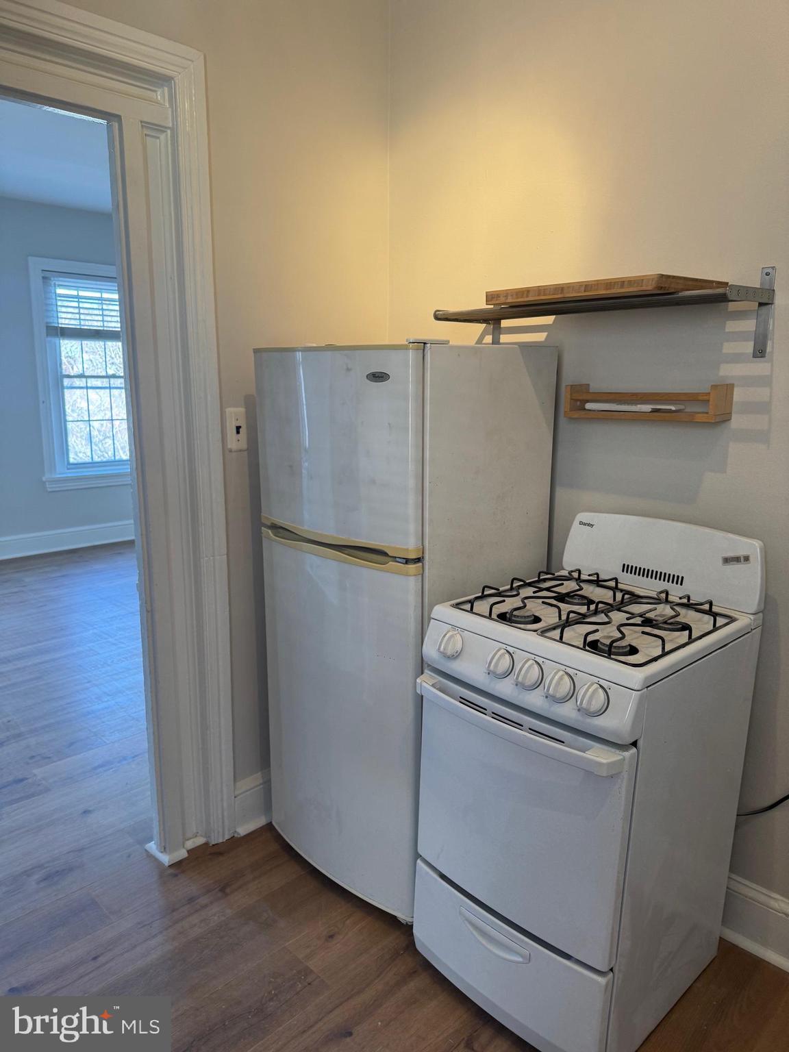 1812 Delaware Avenue, Unit 2 Wilmington, DE 19806 - Photo 9 of 13 a stove top oven sitting inside of a kitchen