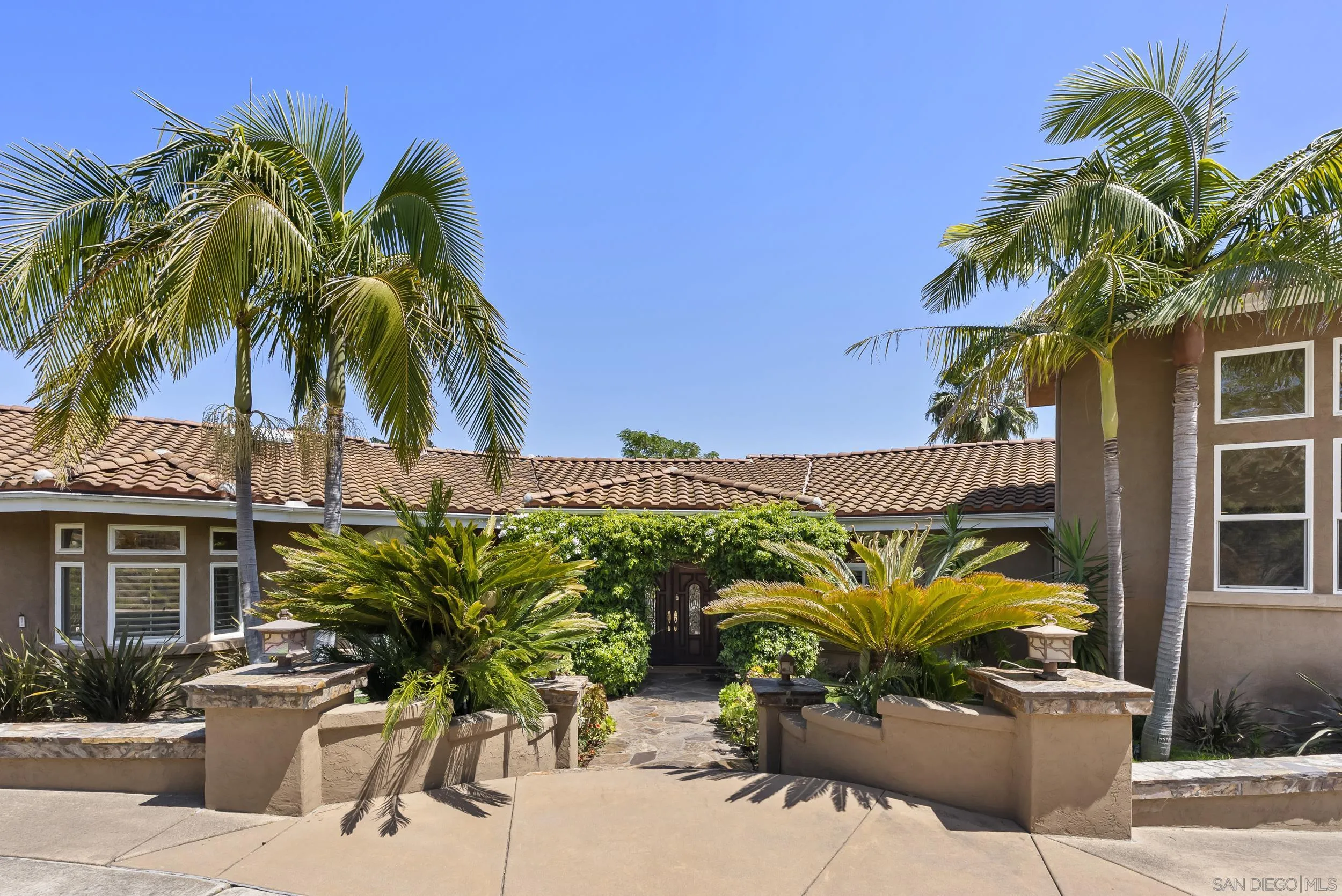 14998 Budwin Lane Poway, CA 92064 - Photo 11 of 44 a view of a house with a patio