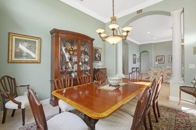 a kitchen with a refrigerator and a stove