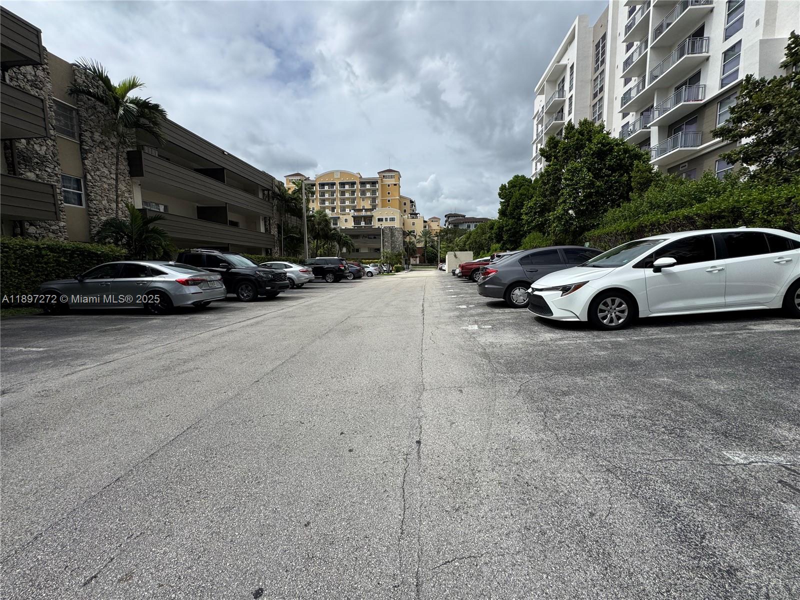 8315 Southwest 72nd Avenue, Unit 101B Miami, FL 33143 - Photo 13 of 18 a view of street with parked cars