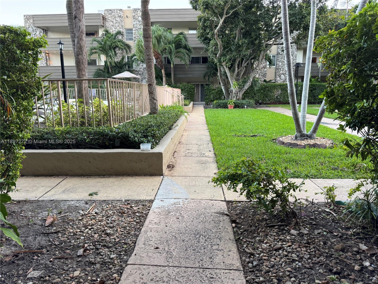 8315 Southwest 72nd Avenue, Unit 101B Miami, FL 33143 - Photo 15 of 18 a view of a garden with pathway