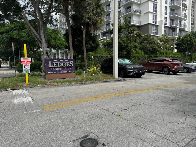 a view of street with parked cars