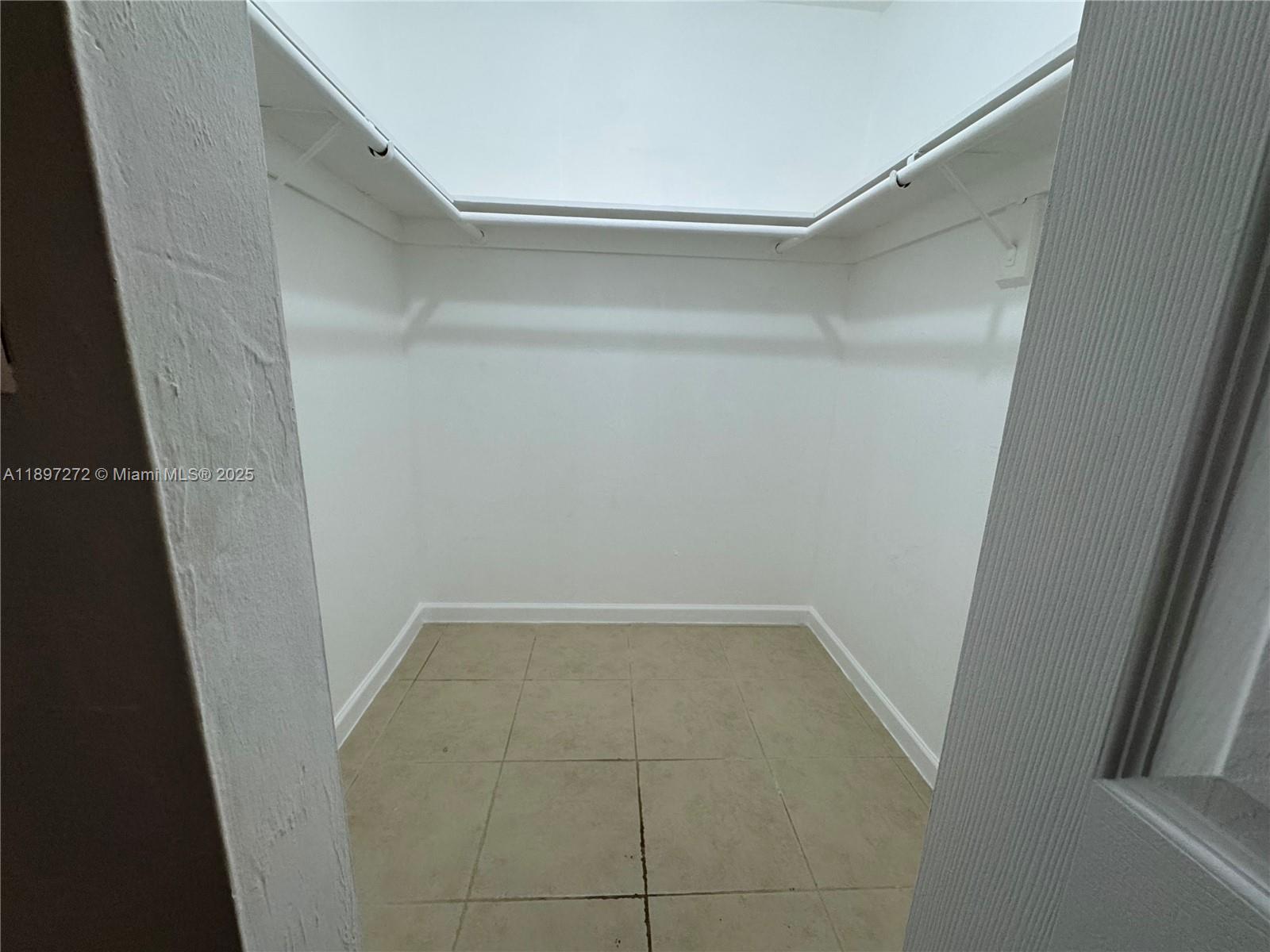 8315 Southwest 72nd Avenue, Unit 101B Miami, FL 33143 - Photo 10 of 18 a view of an empty walk in closet