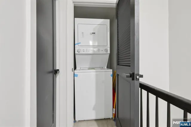 a view of storage and utility room with washer and dryer
