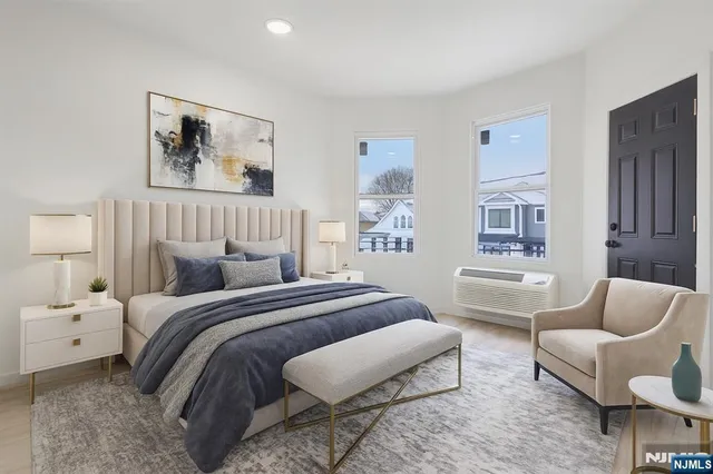 a bedroom with a bed and couch