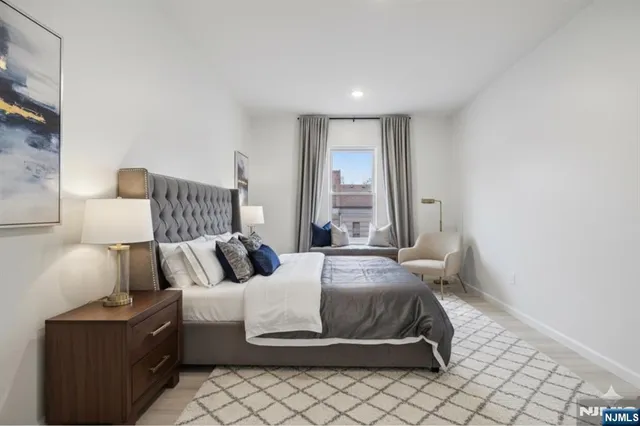 a bedroom with a bed and lamp