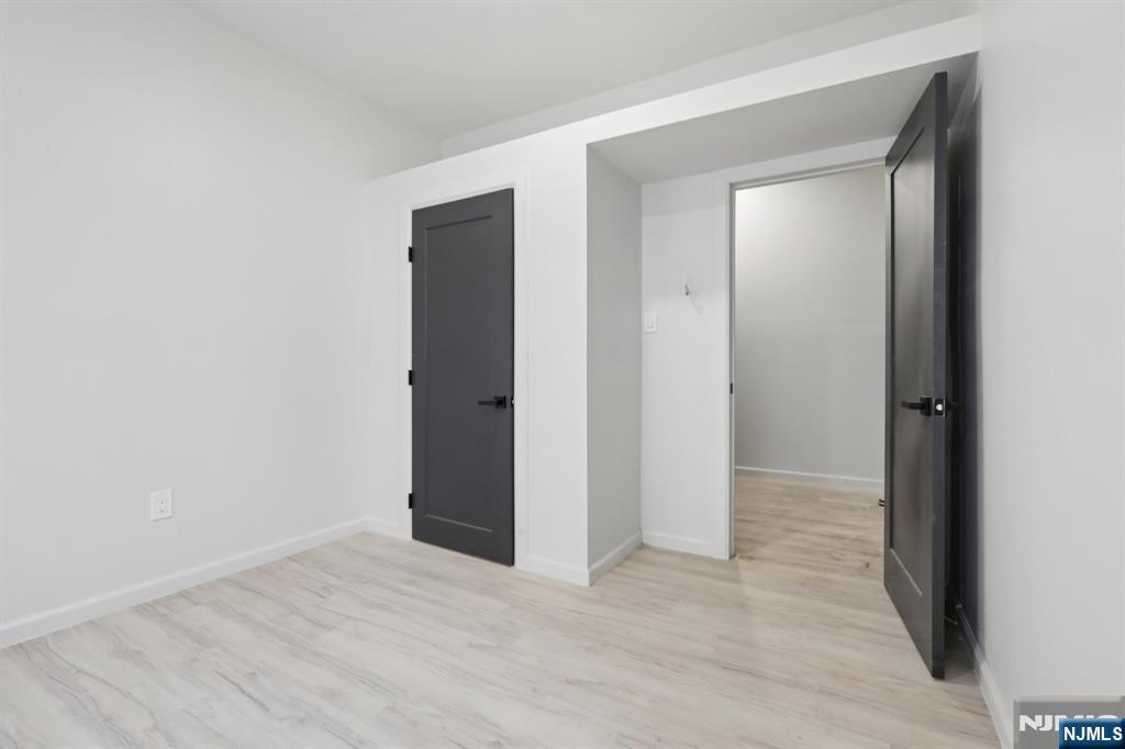 542 East 25th Street, Unit 540 Paterson, NJ 07514 - Photo 9 of 11 a view of an empty room with closet and a window